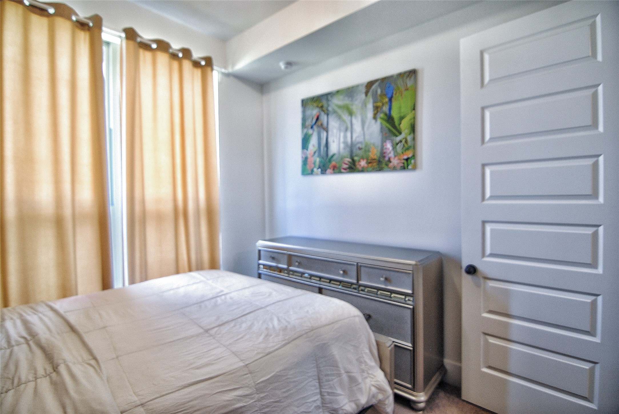 31447 Golden Cliffs Lane Fulshear, TX 77441 - Photo 16 of 45 a bedroom with a bed and a window