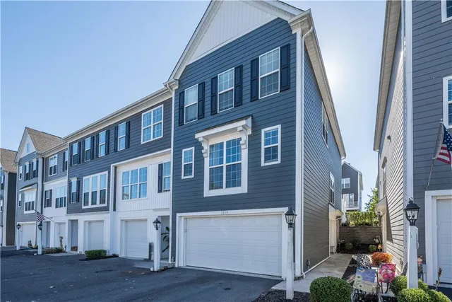 a front view of a building with garden