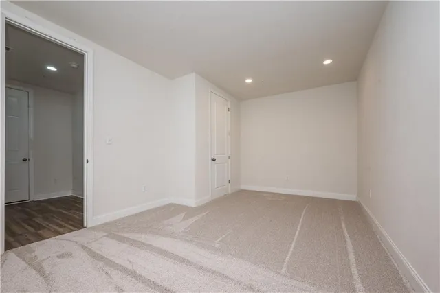 an empty room with a empty space and windows