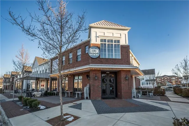 a front view of building with yard