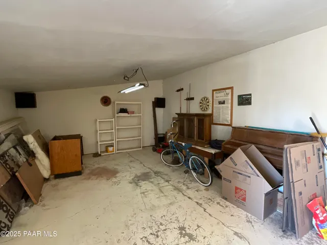 a kitchen with stainless steel appliances granite countertop a sink and a refrigerator