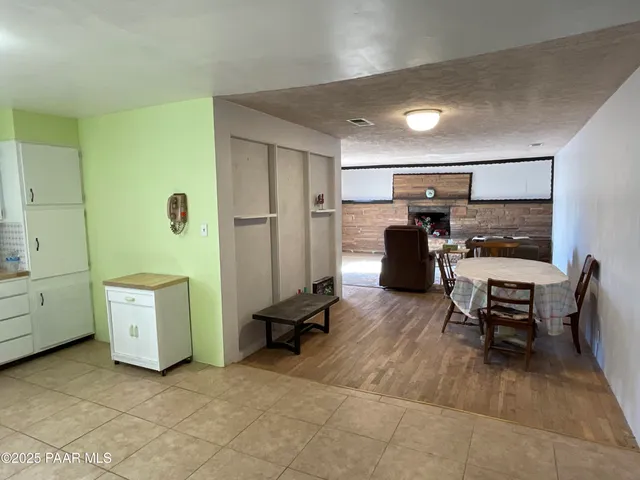 a view of kitchen with furniture and window