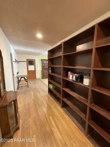a living room with a bed furniture and a window