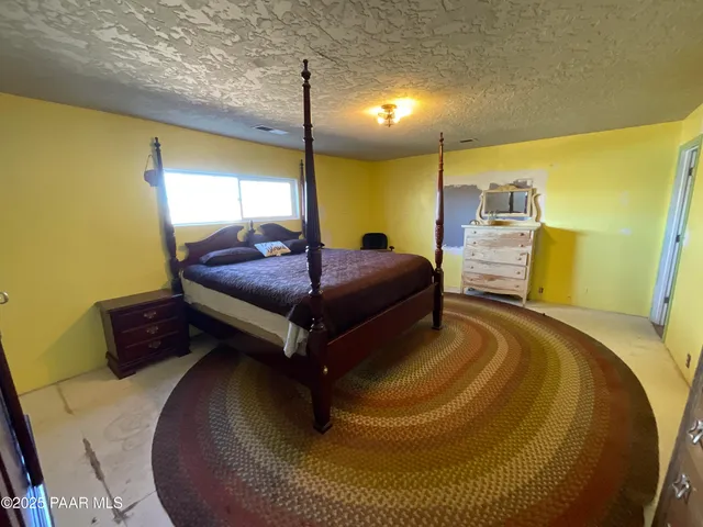 a bathroom with a toilet sink and mirror with bathtub