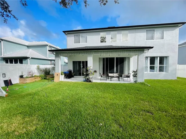 a view of a building with a yard