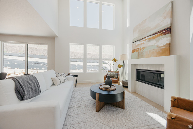 5902 Canyon Rim Road, Unit 620 Lehi, UT 84048 - Photo 22 of 78 Two-story living area featuring a built-in linear fireplace with vertical tile surround