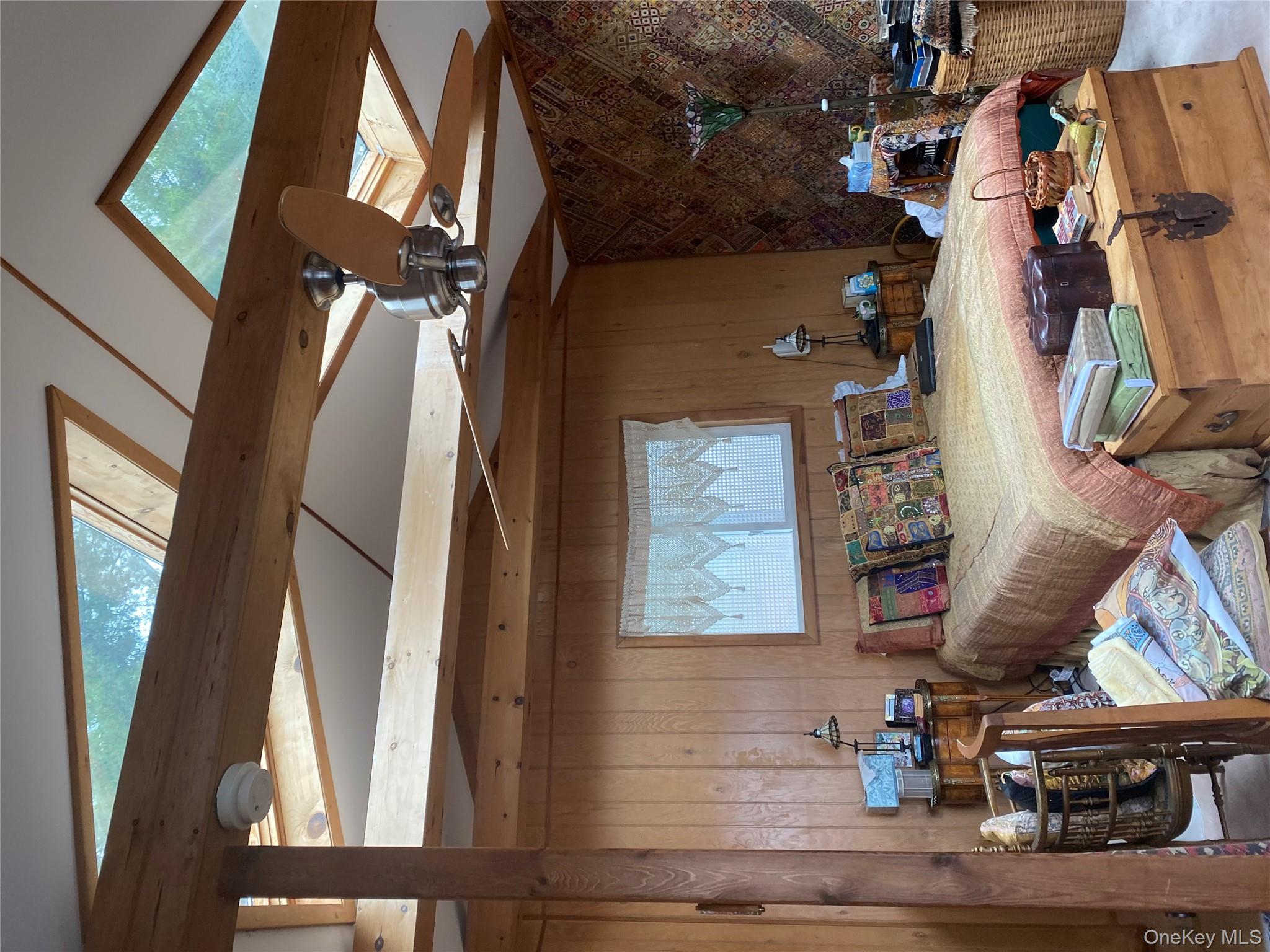 1192 Highway 52, Unit 18 Loch Sheldrake, NY 12759 - Photo 11 of 16 a room with furniture and musical instruments