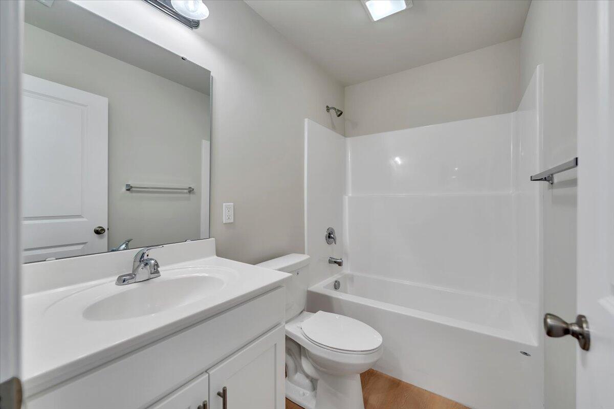 1109 Niagara Road Vinton, VA 24179 - Photo 21 of 25 a bathroom with a sink a toilet and shower