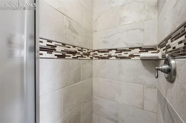 a close view of a shower in bathroom