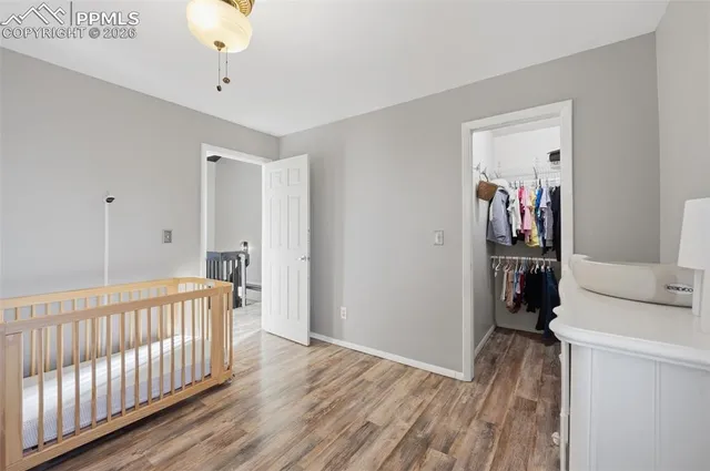 a view of a room with wooden floor