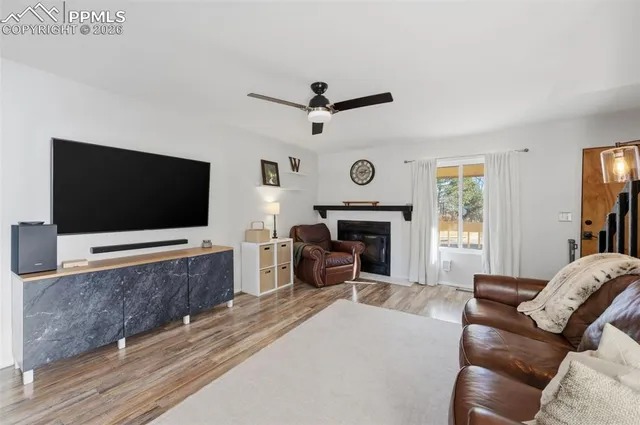 a living room with furniture and a flat screen tv