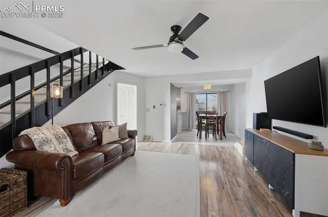 a living room with furniture and a flat screen tv