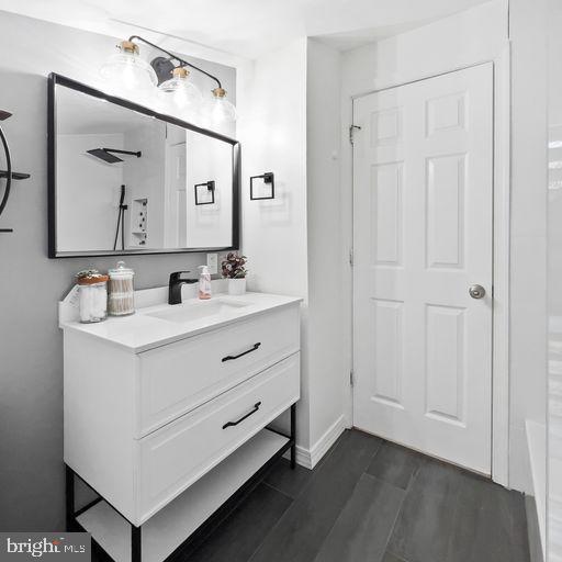 22 East 2nd Street Moorestown, NJ 08057 - Photo 18 of 23 a bathroom with a double vanity sink and mirror