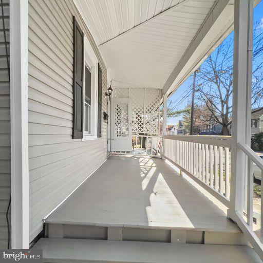 22 East 2nd Street Moorestown, NJ 08057 - Photo 3 of 23 a view of a porch with wooden floor and fence
