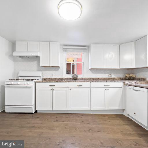 22 East 2nd Street Moorestown, NJ 08057 - Photo 10 of 23 a kitchen with granite countertop white cabinets and white appliances