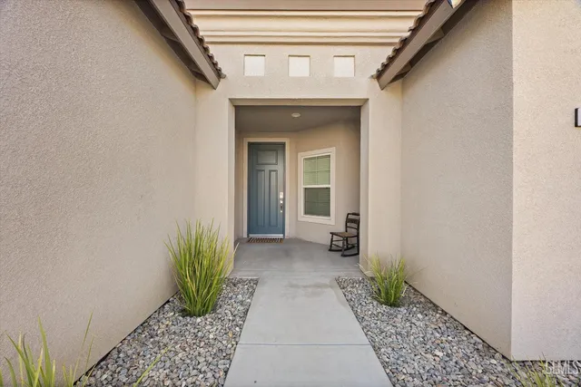 a view of a hallway with a outdoor space