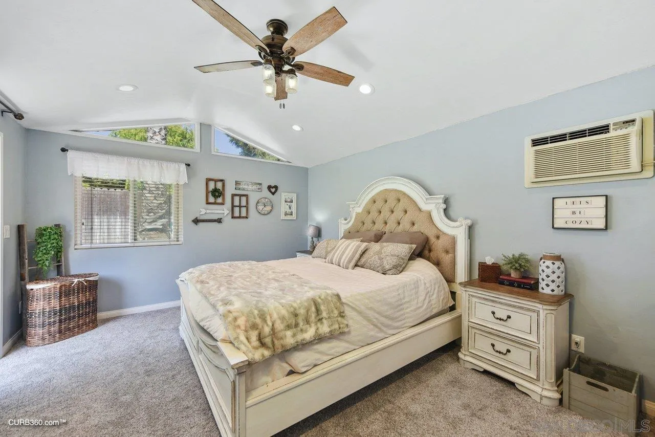 13429 Standish Drive Poway, CA 92064 - Photo 16 of 30 a bedroom with a bed dresser and window