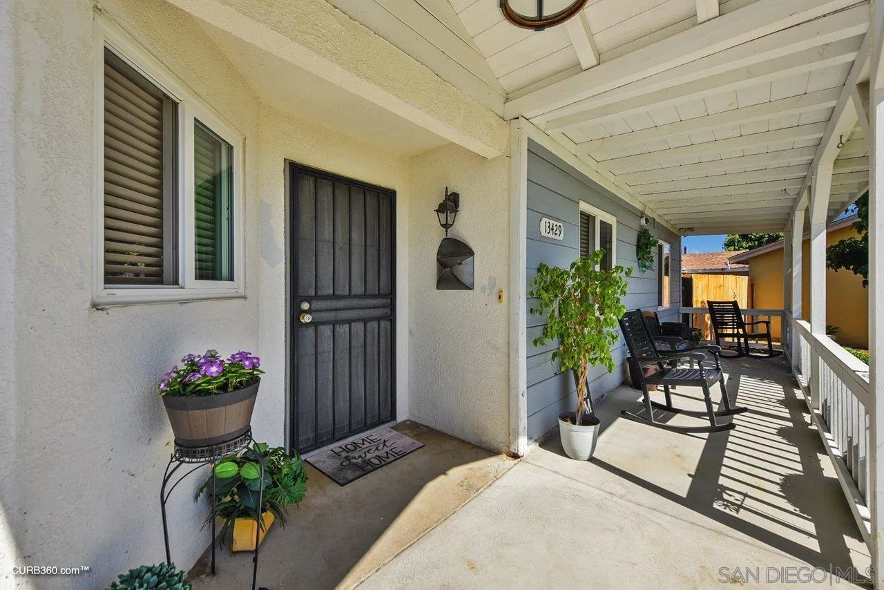 13429 Standish Drive Poway, CA 92064 - Photo 4 of 30 a front view of a house with outdoor seating