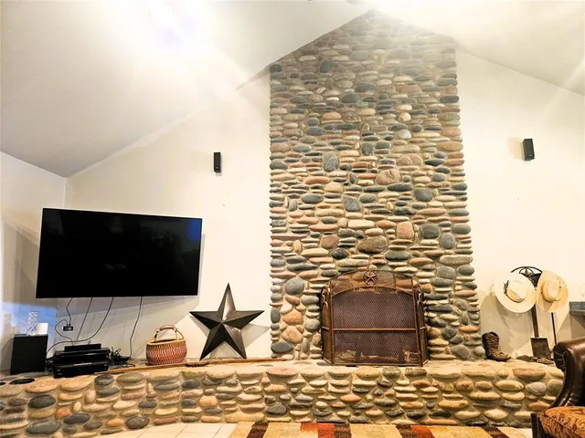 a kitchen with a sink dishwasher and a stove with wooden floor