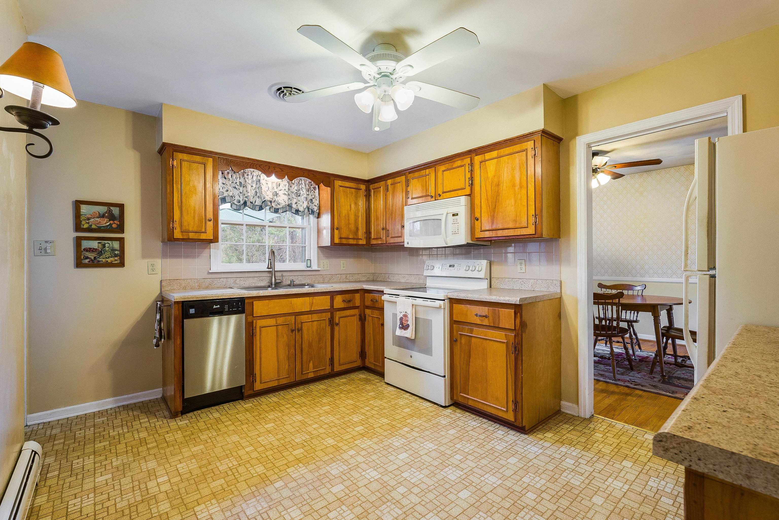 419 Cardinal Street Staunton, VA 24401 - Photo 14 of 47 a kitchen with stainless steel appliances granite countertop a sink and cabinets