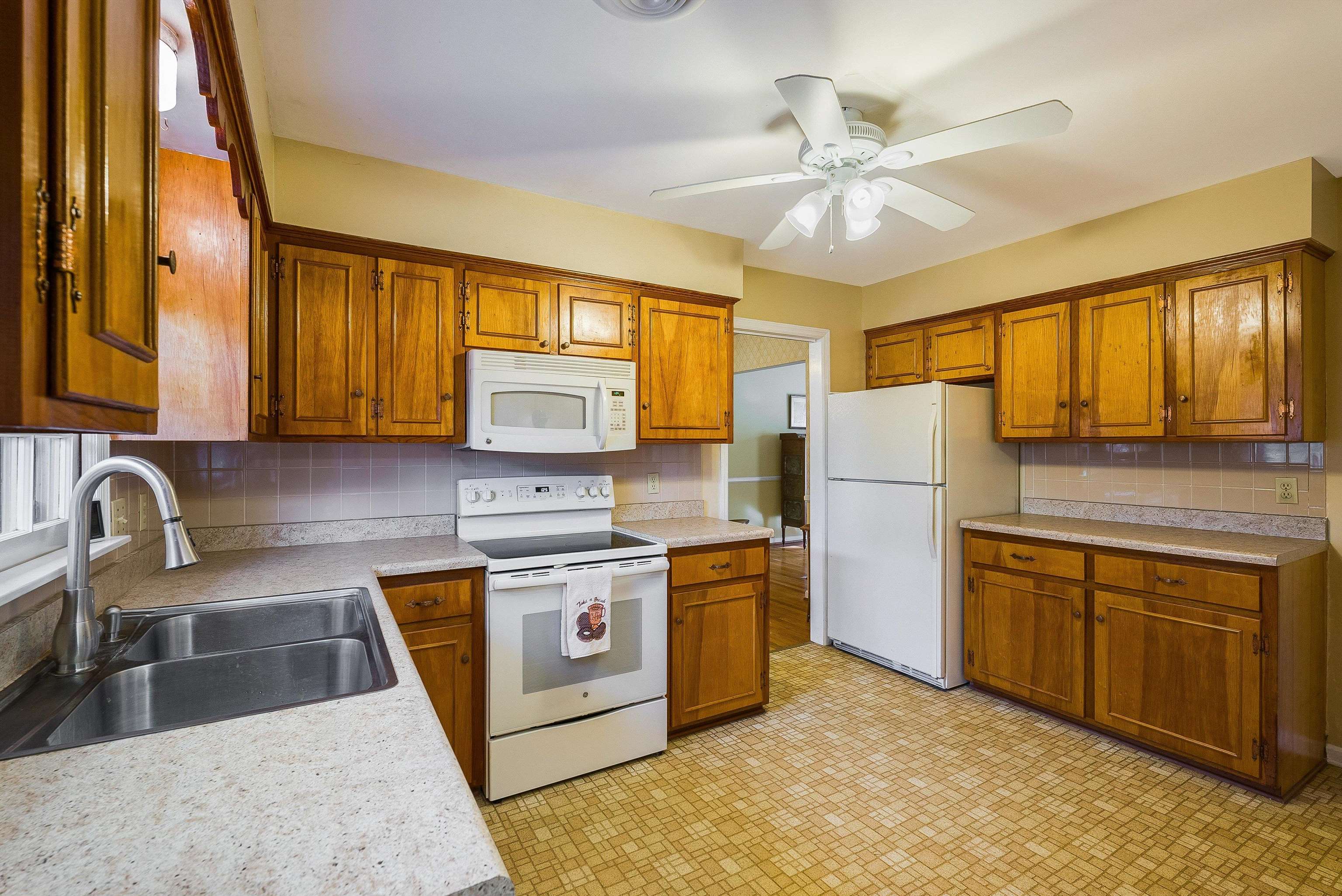419 Cardinal Street Staunton, VA 24401 - Photo 15 of 47 a kitchen with stainless steel appliances granite countertop a sink stove and refrigerator