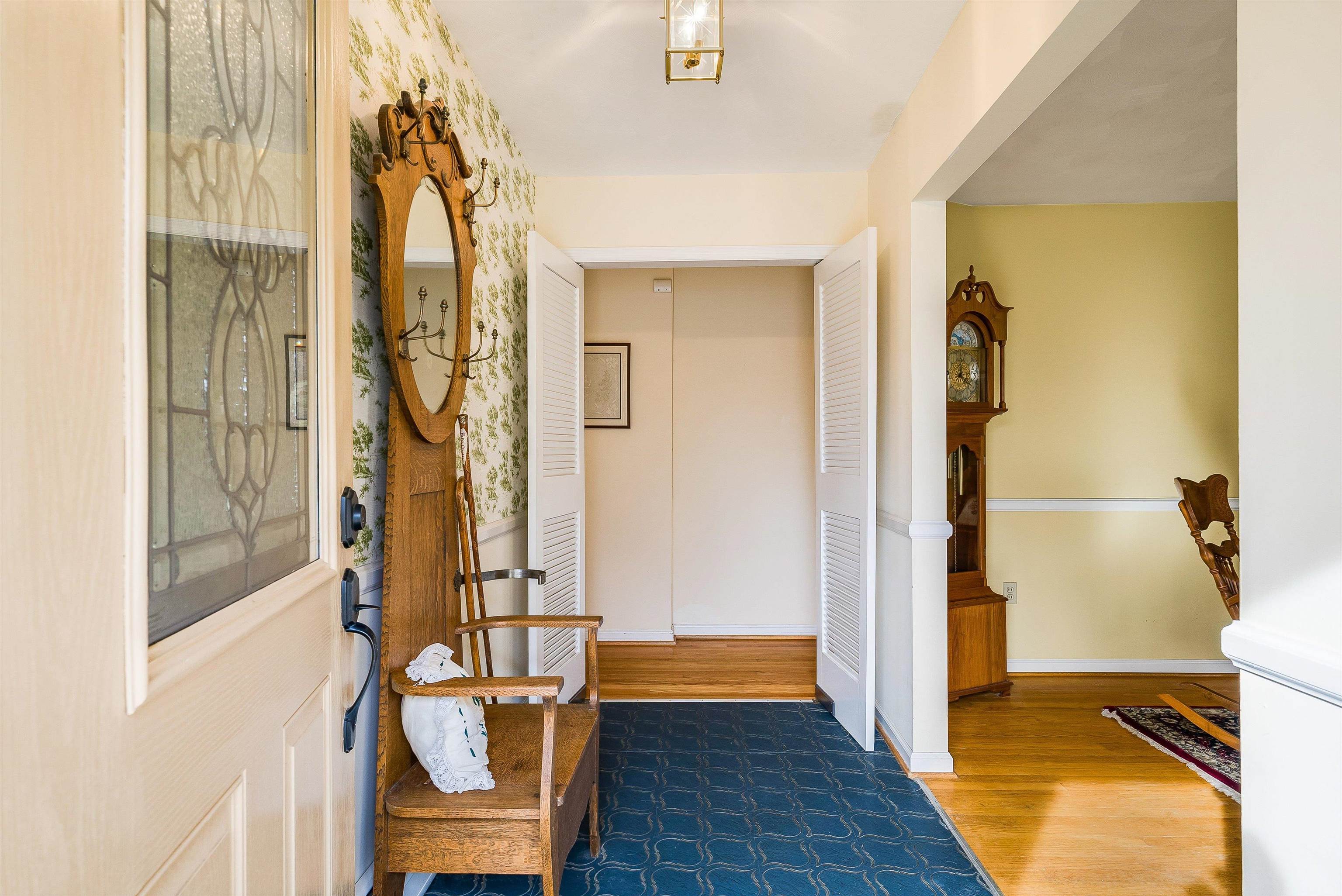 419 Cardinal Street Staunton, VA 24401 - Photo 8 of 47 a view of a hallway with wooden floor and glass door