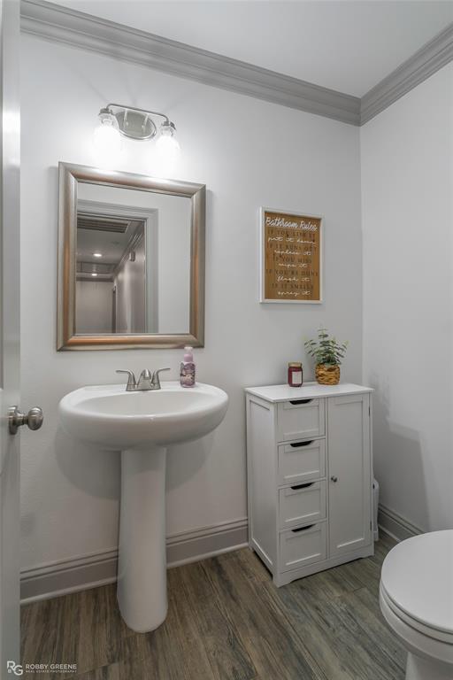 396 Collinswood Road Stonewall, LA 71078 - Photo 23 of 32 a bathroom with a sink toilet and mirror