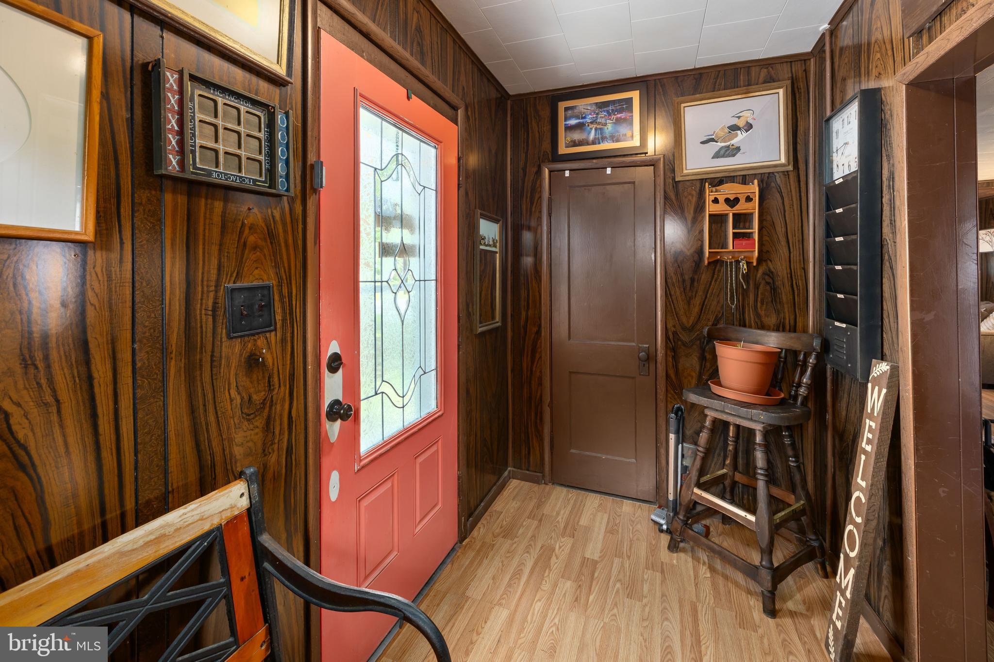 26467 Mariners Road Crisfield, MD 21817 - Photo 13 of 44 a view of a hallway with wooden floor and entryway