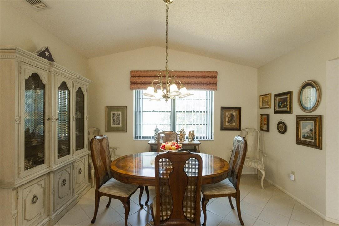 9096 Southwest 20th Street, Unit F Boca Raton, FL 33428 - Photo 16 of 35 a view of a dining room with furniture window and outside view