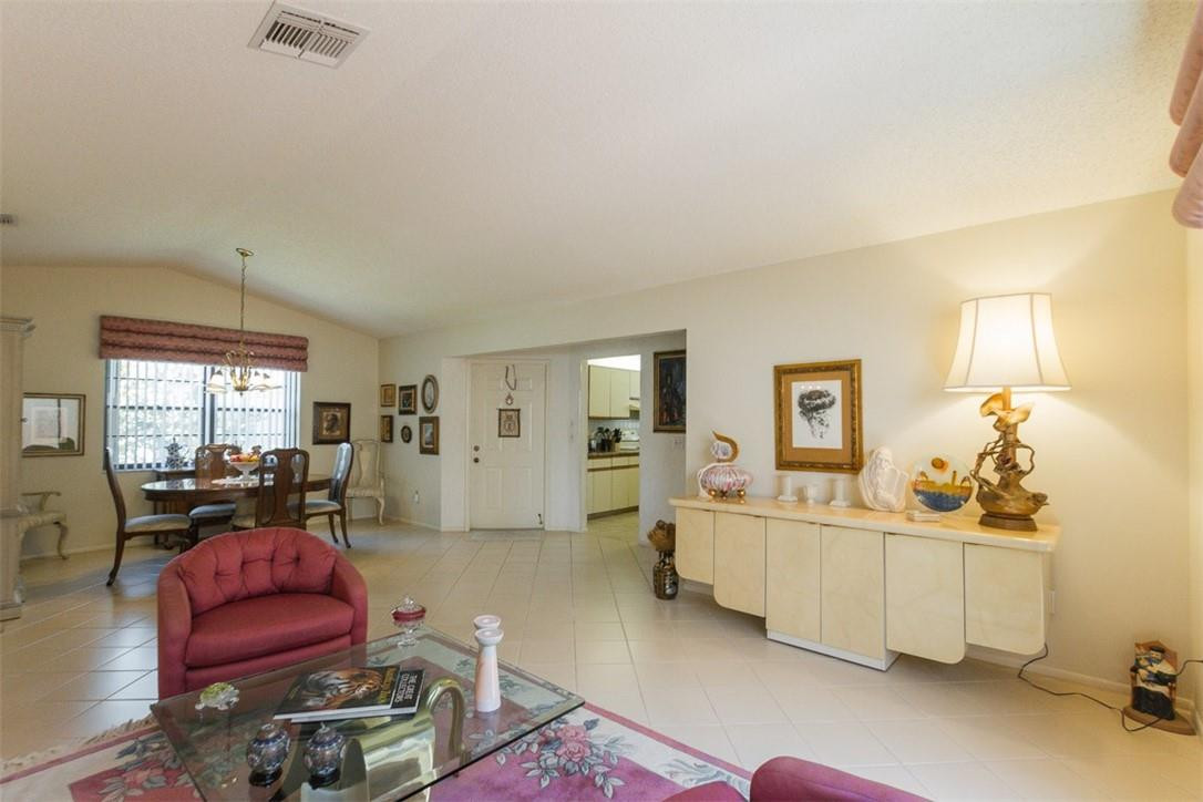 9096 Southwest 20th Street, Unit F Boca Raton, FL 33428 - Photo 8 of 35 a living room with furniture window and wooden floor