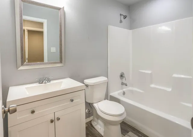 a bathroom with a sink a toilet and a bathtub