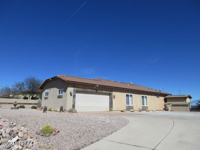 511 Camino Hombre De Oro Rio Rico, AZ 85648 - Photo 2 of 44 a front view of a house with a outdoor space