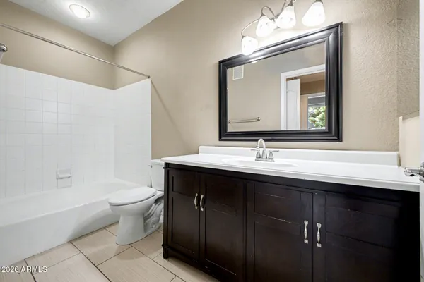 a bathroom with a toilet a sink and a bathtub