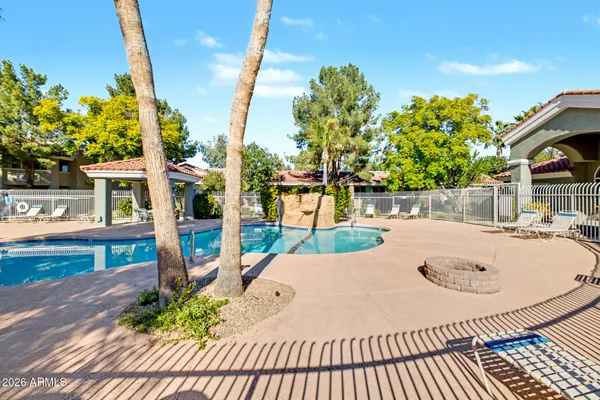 a view of a swimming pool with a patio