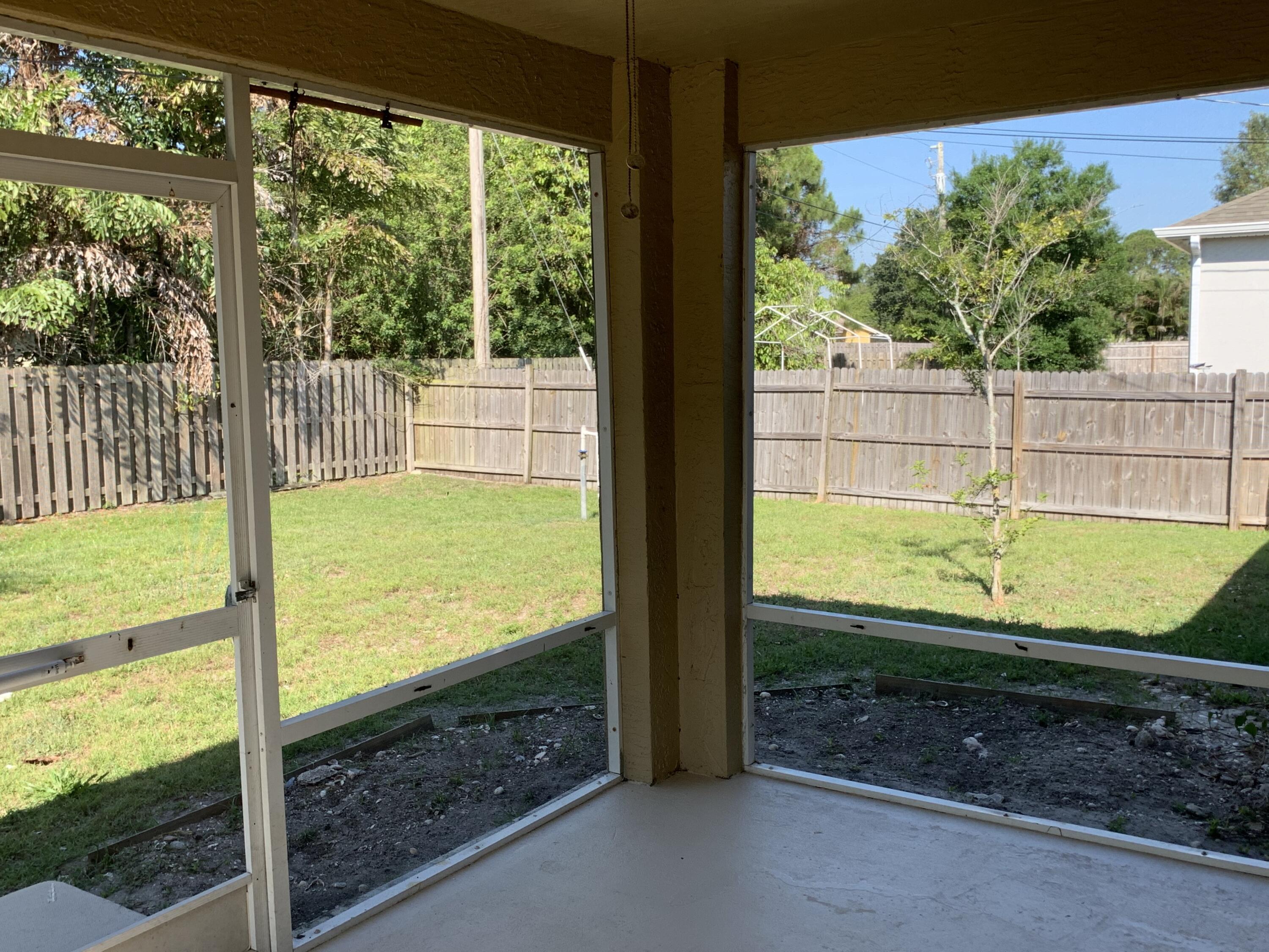 269 Southwest Ridgecrest Drive Port St. Lucie, FL 34953 - Photo 17 of 24 a view of a garden from a window