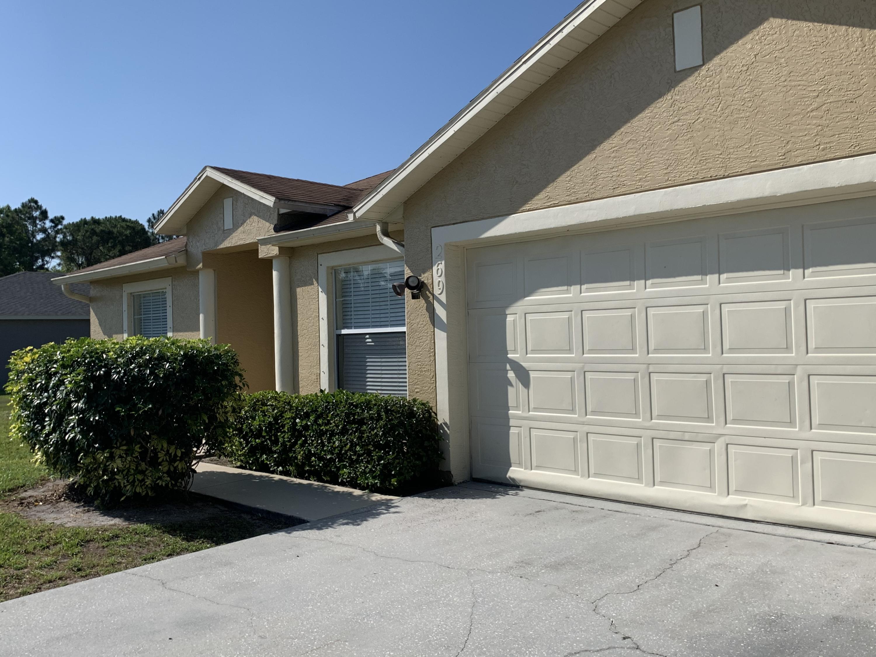 269 Southwest Ridgecrest Drive Port St. Lucie, FL 34953 - Photo 5 of 24 front view of a house