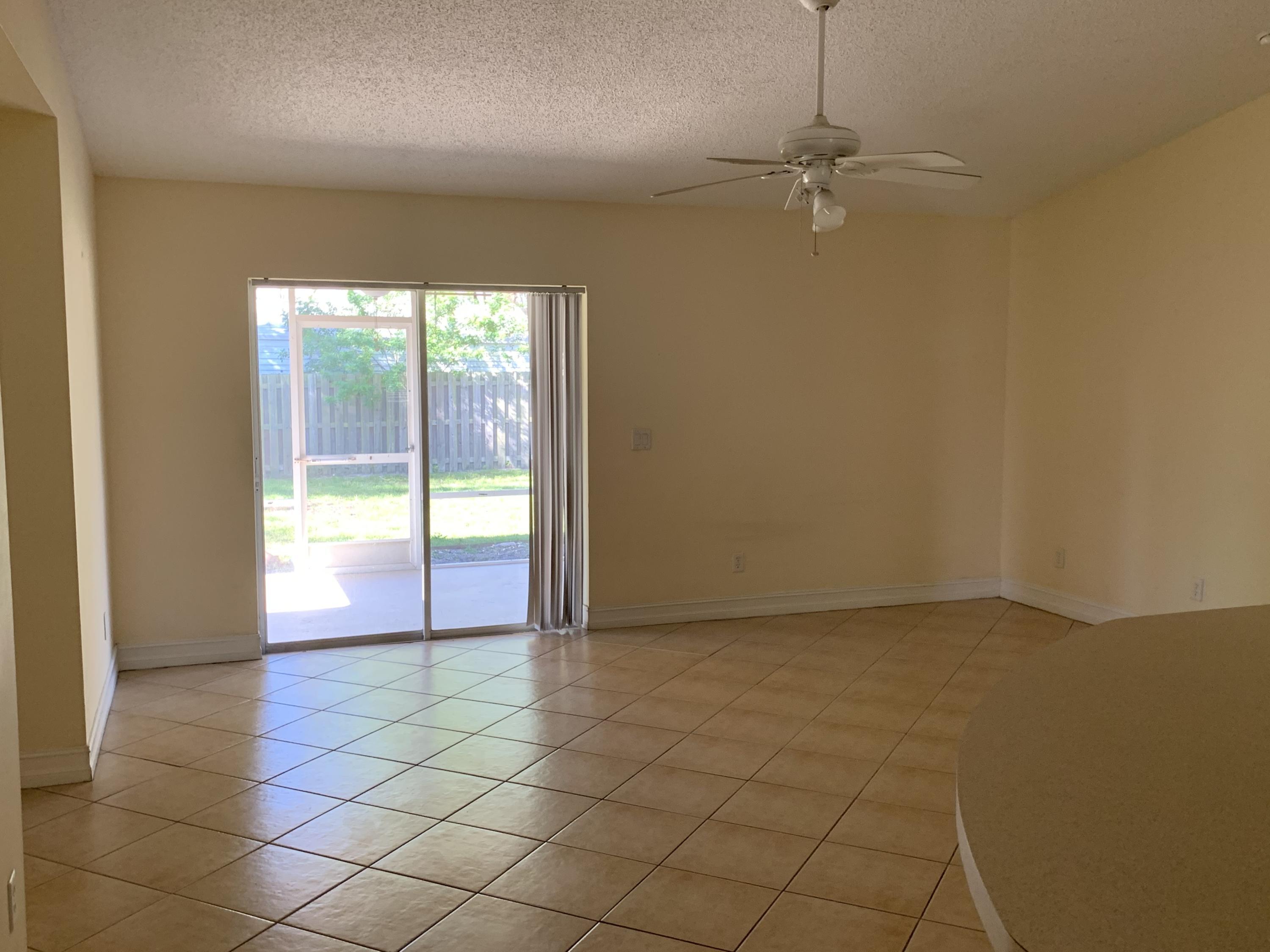 269 Southwest Ridgecrest Drive Port St. Lucie, FL 34953 - Photo 8 of 24 a view of an empty room and window
