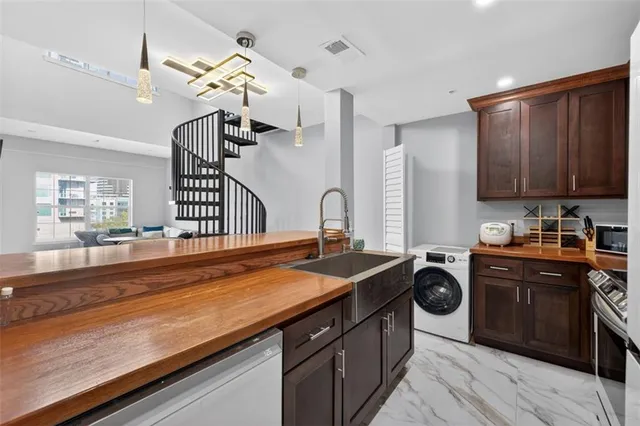 a kitchen with a sink and cabinets