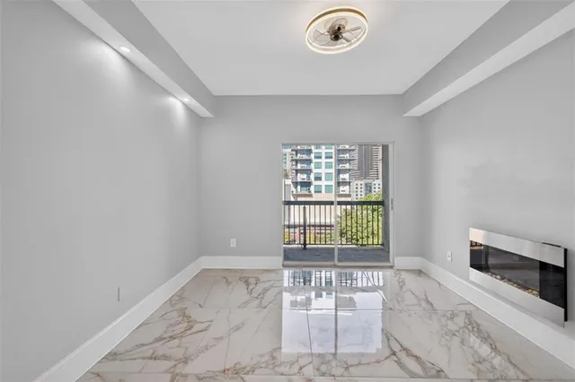 a view of an empty room with a window