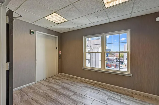 a view of an empty room with a window
