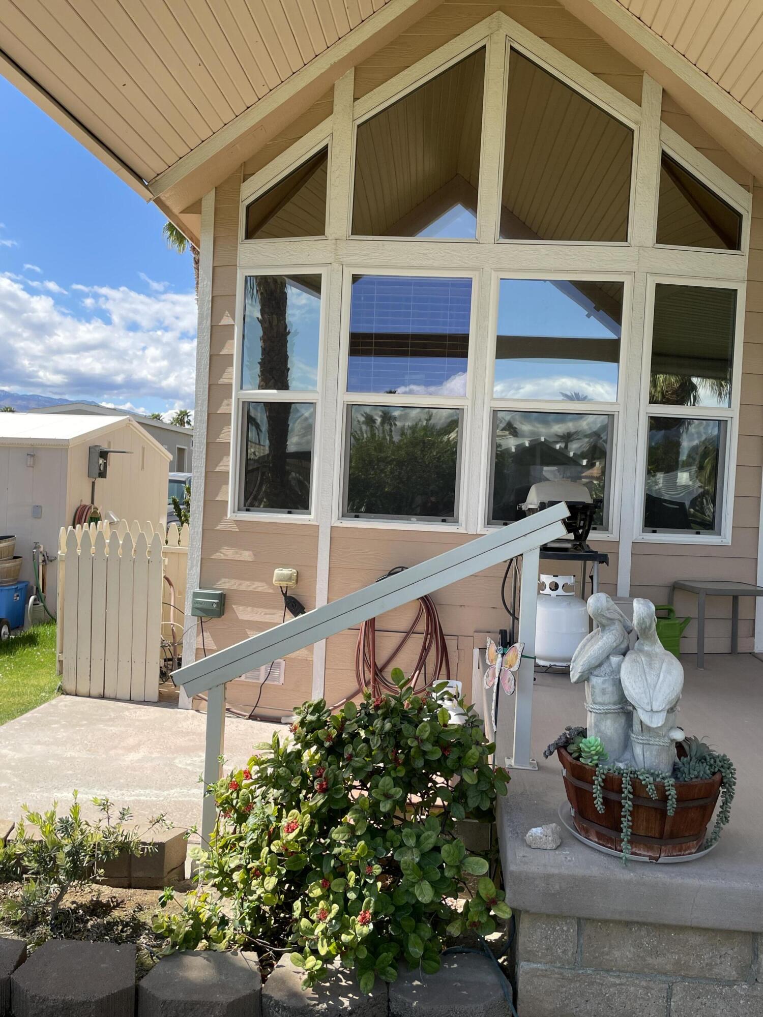 81620 Ave 49, Unit 235B Indio, CA 92201 - Photo 14 of 21 a front view of a house with a porch