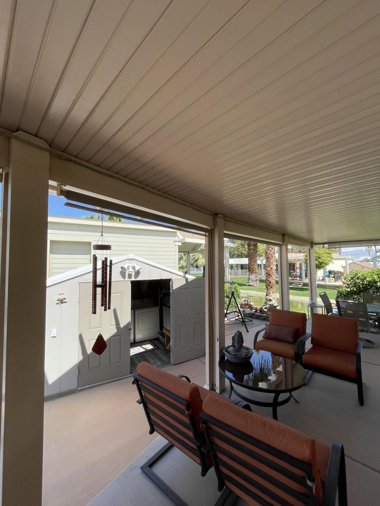 81620 Ave 49, Unit 235B Indio, CA 92201 - Photo 20 of 21 a room with furniture a ceiling fan and a window