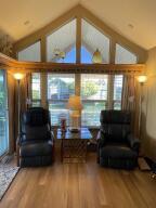 81620 Ave 49, Unit 235B Indio, CA 92201 - Photo 21 of 21 a living room with furniture and a floor to ceiling window