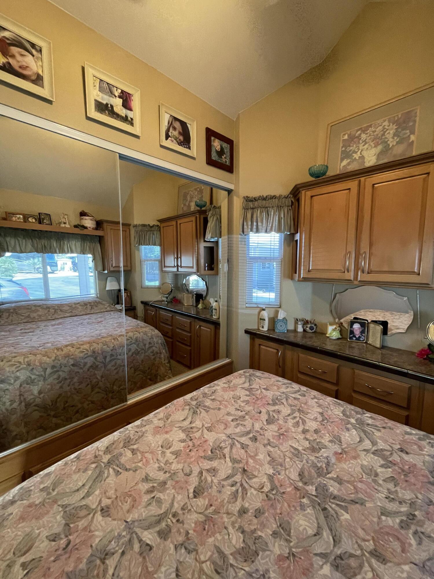 81620 Ave 49, Unit 235B Indio, CA 92201 - Photo 5 of 21 a kitchen with stainless steel appliances granite countertop a refrigerator and stove