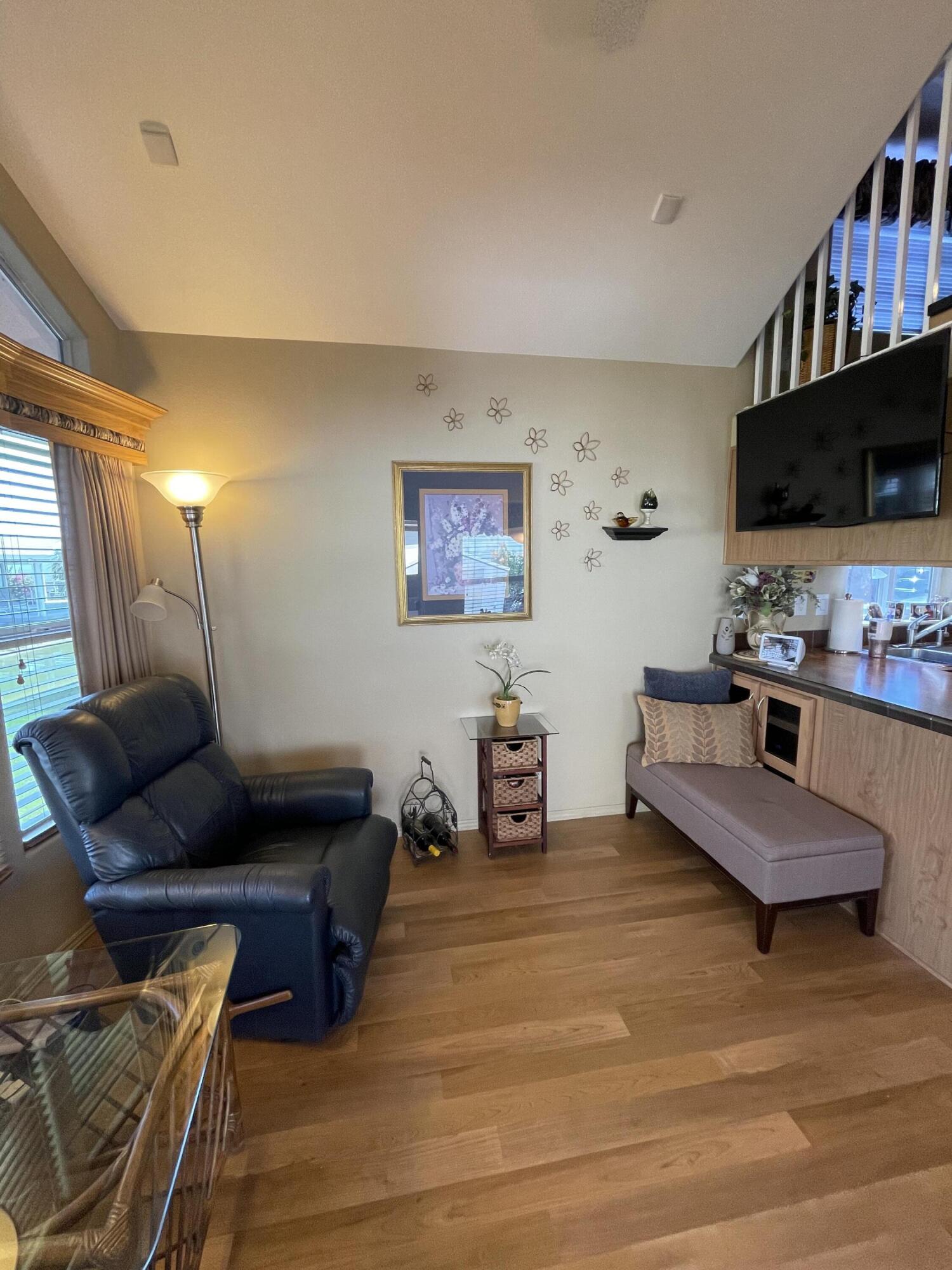 81620 Ave 49, Unit 235B Indio, CA 92201 - Photo 6 of 21 a living room with furniture and a flat screen tv