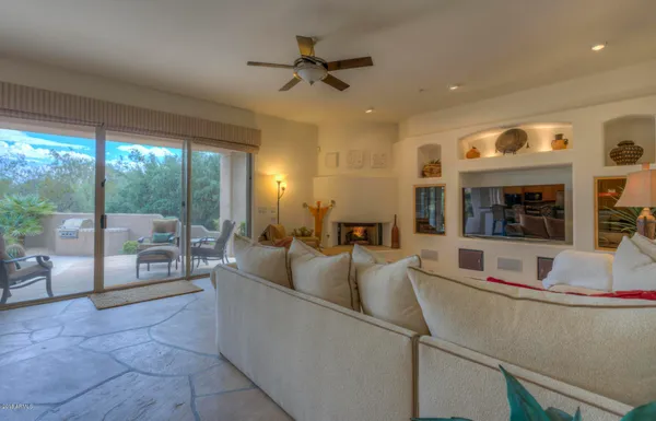 a living room with furniture and a large window