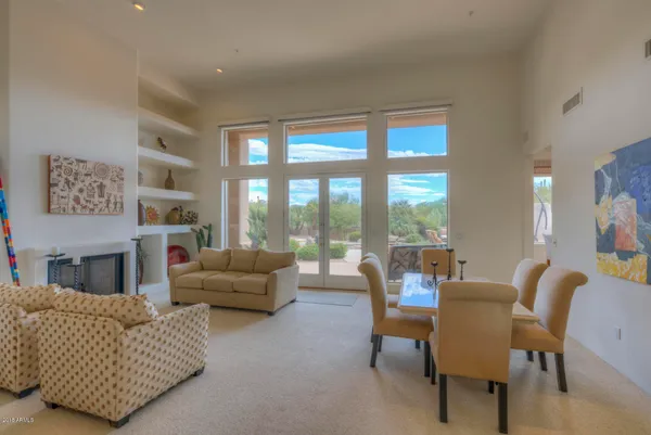 a living room with furniture and a large window