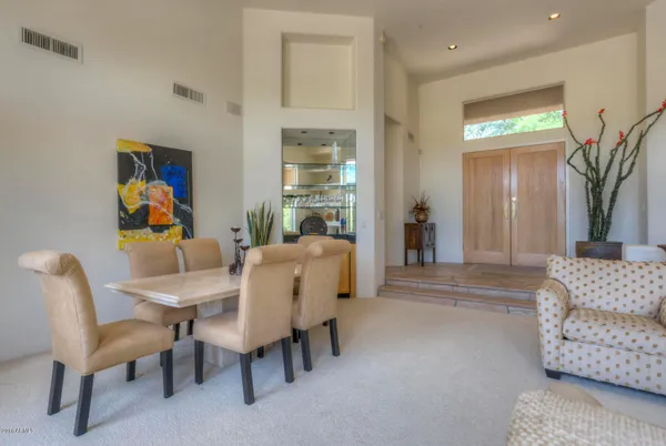 a dining room with furniture and window