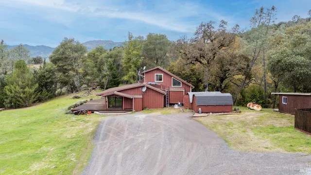 a house with trees in the background