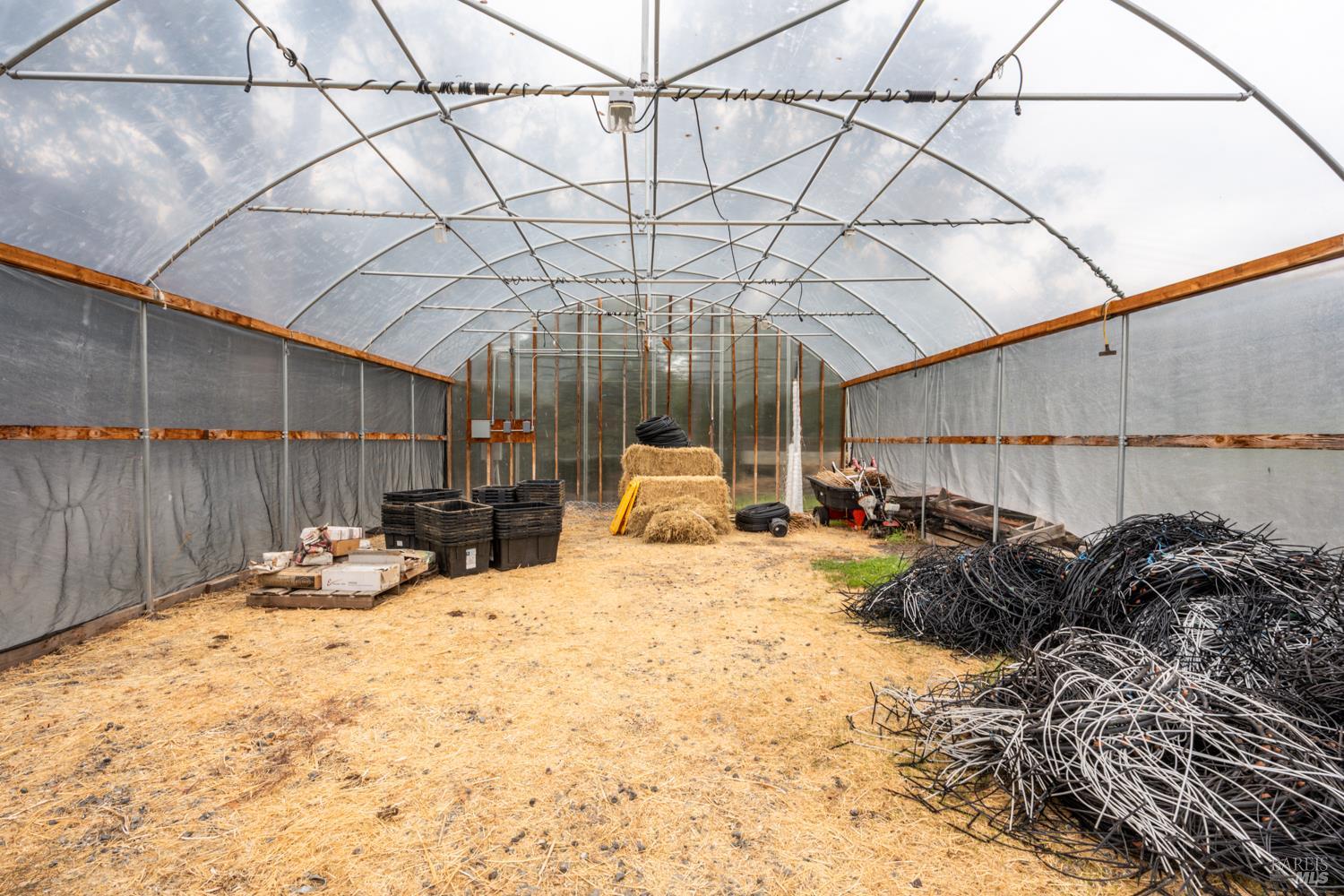 13800 Poonkinney Road Dos Rios, CA 95429 - Photo 12 of 28 a bed room with a bed and a chair